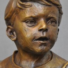 Bronze portrait sculpture of child named ANDREW. Made for a private collection.