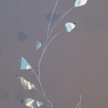 This mobile is titled "CLEFF" and features aluminum and glass materials.