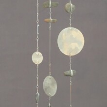 "MEDITATIONS I" is a mobile created with aluminum, steel, and pebble.