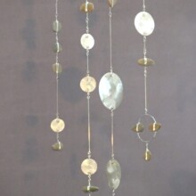 Depicted is a mobile titled "MEDITATIONS II." Materials used include aluminum, steel, and pebble.