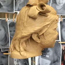 Portrait sculpture of child named SCARLETT, commissioned for private collection. In this picture, the sculpture is in progress and in its clay state.