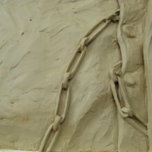 This is a detail photo of the WINSTON CHURCHILL sculpture in-progress in its clay state.