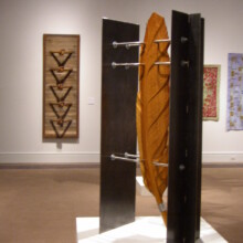 Richard Pumphrey's woodcarving "COMPROMISED VII" made with wood, stainless steel, and steel.