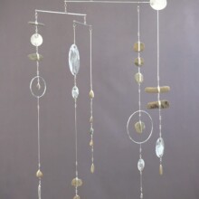 Mobile created by Richard Pumphrey, titled "MEDITATIONS IV" and created with aluminum, steel, and pebble.