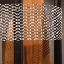 Richard Pumphrey's wood carving art titled "COMPROMISED VI." This is a detail image. Materials: wood, steel, and aluminum.