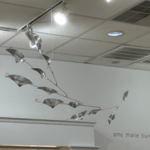 Mobile titled "DIVE" and created with aluminum and plated steel.